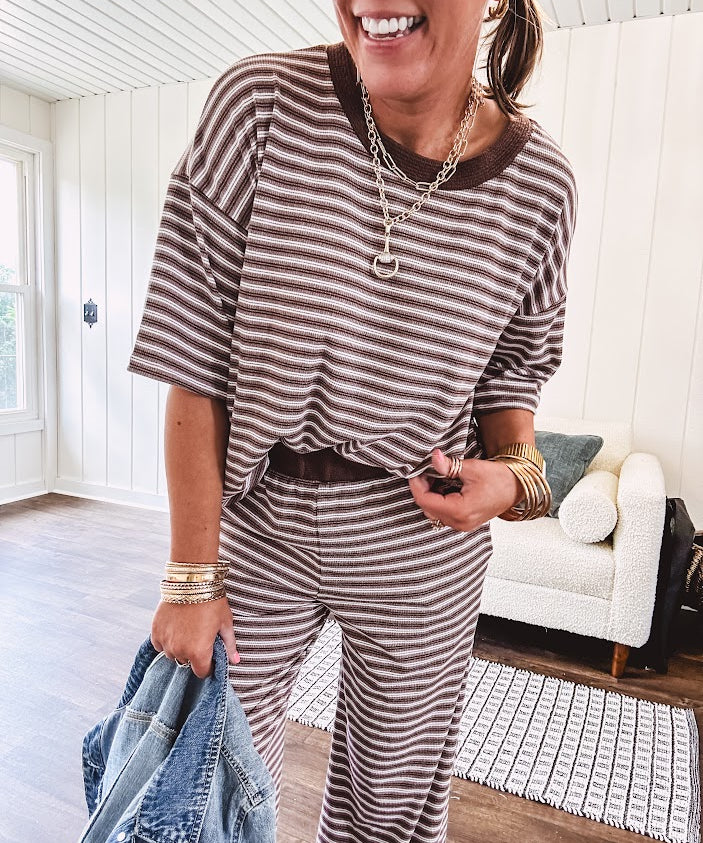 Lightweight ribbed texture brown and white striped short sleeve top and matching wide leg bottoms with elastic waist and contrasting dark brown waffle texture neckline and waistband.