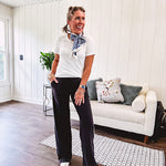 Buttery soft black lounge pants with white striping down the sides and elastic waist with pleated front.