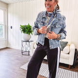 Buttery soft black lounge pants with white striping down the sides and elastic waist with pleated front.