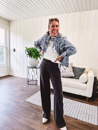 Buttery soft black lounge pants with white striping down the sides and elastic waist with pleated front.