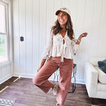 Light copper denim barrel style jeans with ankle length and twisted seam detail on the sides.