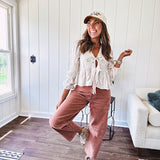 Light copper denim barrel style jeans with ankle length and twisted seam detail on the sides.