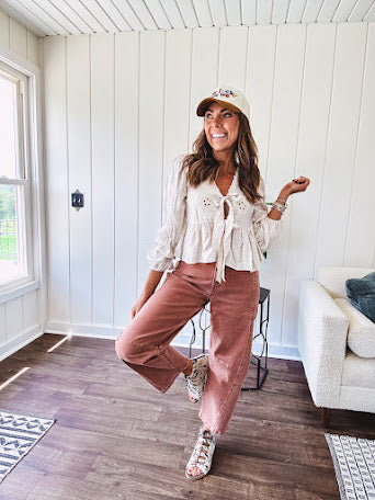 Light copper denim barrel style jeans with ankle length and twisted seam detail on the sides.