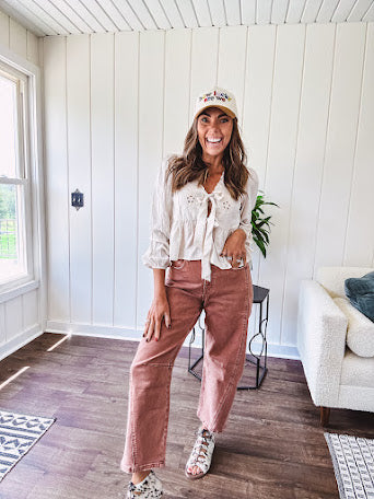 Light copper denim barrel style jeans with ankle length and twisted seam detail on the sides.