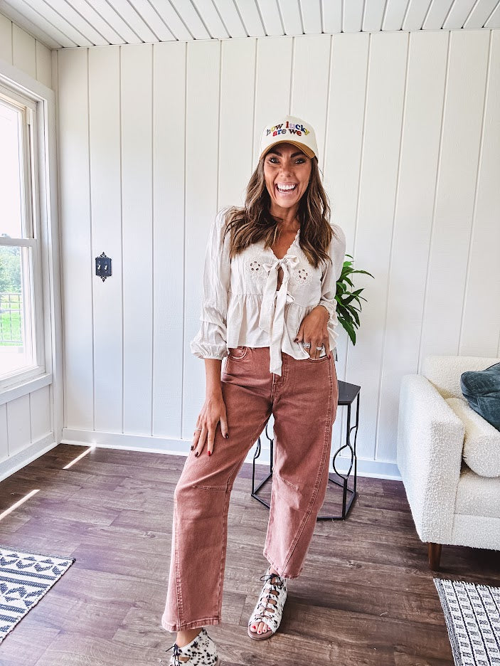 Light copper denim barrel style jeans with ankle length and twisted seam detail on the sides.