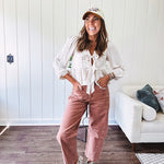 Light copper denim barrel style jeans with ankle length and twisted seam detail on the sides.