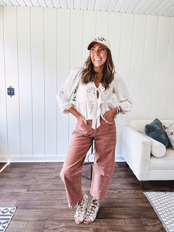 Light copper denim barrel style jeans with ankle length and twisted seam detail on the sides.