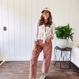 Light copper denim barrel style jeans with ankle length and twisted seam detail on the sides.