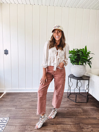 Light copper denim barrel style jeans with ankle length and twisted seam detail on the sides.