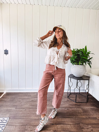 Light copper denim barrel style jeans with ankle length and twisted seam detail on the sides.
