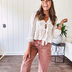 Light copper denim barrel style jeans with ankle length and twisted seam detail on the sides.