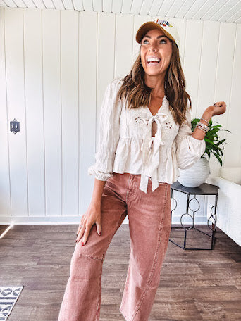 Light copper denim barrel style jeans with ankle length and twisted seam detail on the sides.