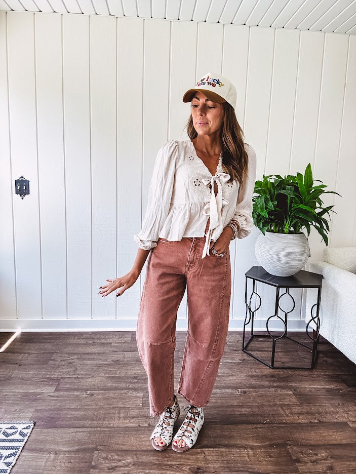 Light copper denim barrel style jeans with ankle length and twisted seam detail on the sides.