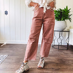 Light copper denim barrel style jeans with ankle length and twisted seam detail on the sides.