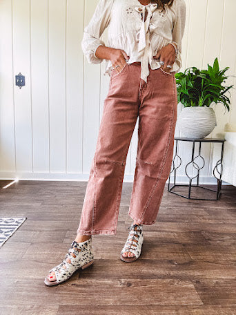 Light copper denim barrel style jeans with ankle length and twisted seam detail on the sides.