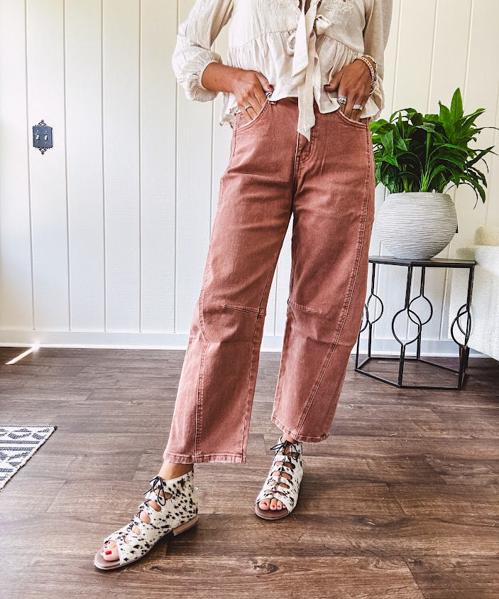 Light copper denim barrel style jeans with ankle length and twisted seam detail on the sides.