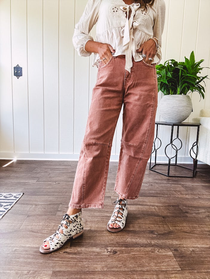 Light copper denim barrel style jeans with ankle length and twisted seam detail on the sides.