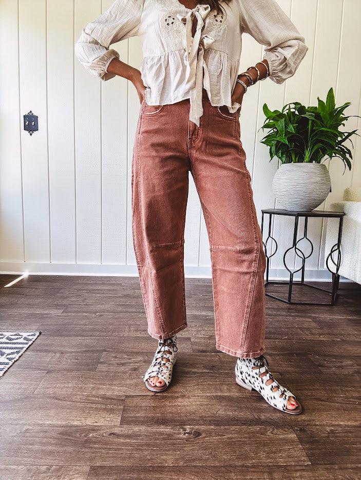 Light copper denim barrel style jeans with ankle length and twisted seam detail on the sides.