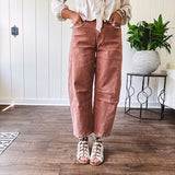 Light copper denim barrel style jeans with ankle length and twisted seam detail on the sides.