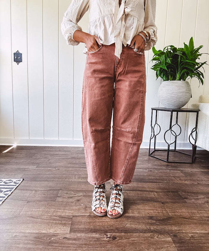 Light copper denim barrel style jeans with ankle length and twisted seam detail on the sides.