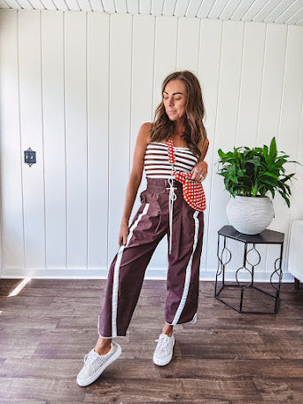 Ribbed texture stretchy tube top with gathering at the bust and cropped hem.