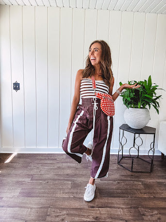 Ribbed texture stretchy tube top with gathering at the bust and cropped hem.