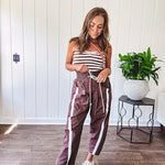 Ribbed texture stretchy tube top with gathering at the bust and cropped hem.