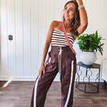 Ribbed texture stretchy tube top with gathering at the bust and cropped hem.