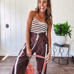 Ribbed texture stretchy tube top with gathering at the bust and cropped hem.