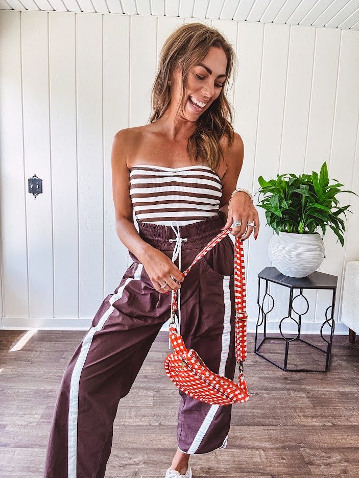 Ribbed texture stretchy tube top with gathering at the bust and cropped hem.