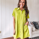 Chartreuse short sleeved button down dress, mini length with pintuck detail in front and pockets.