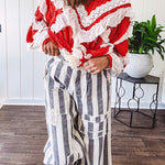 Wide leg cotton oversized gray and white striped pants with elastic back, button and zipper closure and crochet patch detail throughout.