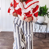 Wide leg cotton oversized gray and white striped pants with elastic back, button and zipper closure and crochet patch detail throughout.