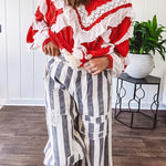 Wide leg cotton oversized gray and white striped pants with elastic back, button and zipper closure and crochet patch detail throughout.