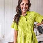 Chartreuse short sleeved button down dress, mini length with pintuck detail in front and pockets.