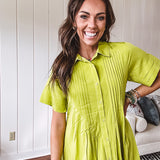 Chartreuse short sleeved button down dress, mini length with pintuck detail in front and pockets.
