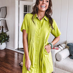Chartreuse short sleeved button down dress, mini length with pintuck detail in front and pockets.