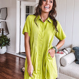 Chartreuse short sleeved button down dress, mini length with pintuck detail in front and pockets.