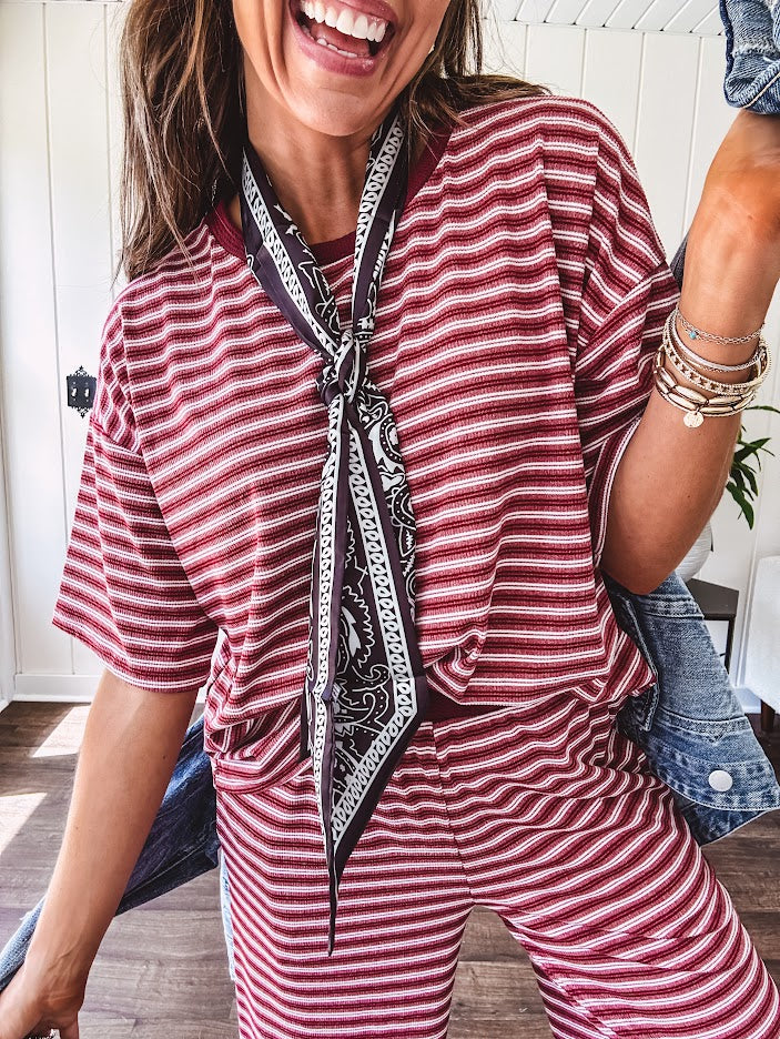 Soft and lightweight ribbed textured short sleeve top in burgundy and white stripes with matching wide leg pants with contrasting waffle texture round neck and elastic waist.