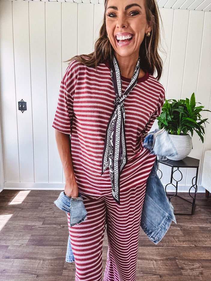 Soft and lightweight ribbed textured short sleeve top in burgundy and white stripes with matching wide leg pants with contrasting waffle texture round neck and elastic waist.