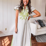 Sage and white striped midi length dress with short sleeves, mock collar, V neck and sage floral embroidery at the yoke and sage trim with side slits.