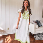 Sage and white striped midi length dress with short sleeves, mock collar, V neck and sage floral embroidery at the yoke and sage trim with side slits.