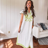 Sage and white striped midi length dress with short sleeves, mock collar, V neck and sage floral embroidery at the yoke and sage trim with side slits.