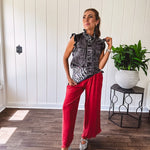 Linen and cotton blend flowy wide leg pants with elastic waist, pockets and frayed hem and pockets.