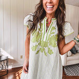 Sage and white striped midi length dress with short sleeves, mock collar, V neck and sage floral embroidery at the yoke and sage trim with side slits.