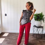 Linen and cotton blend flowy wide leg pants with elastic waist, pockets and frayed hem and pockets.
