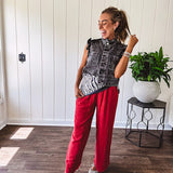 Linen and cotton blend flowy wide leg pants with elastic waist, pockets and frayed hem and pockets.