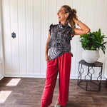 Linen and cotton blend flowy wide leg pants with elastic waist, pockets and frayed hem and pockets.