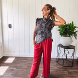 Linen and cotton blend flowy wide leg pants with elastic waist, pockets and frayed hem and pockets.