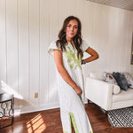 Sage and white striped midi length dress with short sleeves, mock collar, V neck and sage floral embroidery at the yoke and sage trim with side slits.